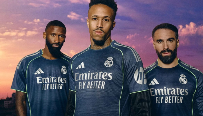 Camisa reserva Real Madrid 2025 2026 Adidas, azul marinho com detalhes prateados e verde neon, modelo torcedor manga curta ou longa com textura frontal inspirada na Champions League